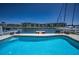 Pool overlooking marina and waterfront condominiums at 4849 Floramar Ter, New Port Richey, FL 34652