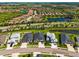 Aerial view showcasing the community layout with lakes, landscaping, and residential homes at 4906 Los Robles Ct, Palmetto, FL 34221