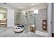 Large walk-in shower features stylish tile and seating at 4906 Los Robles Ct, Palmetto, FL 34221