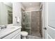 Modern bathroom with glass-enclosed shower, updated vanity, and a comfort-height toilet at 4906 Los Robles Ct, Palmetto, FL 34221