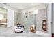 Modern bathroom featuring an oversized glass shower, neutral tile, and seating at 4906 Los Robles Ct, Palmetto, FL 34221