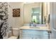 Bathroom featuring white vanity, decorative shower curtain, and modern fixtures at 4906 Los Robles Ct, Palmetto, FL 34221