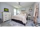 Cozy bedroom features a plush bed, side tables, and dresser at 4906 Los Robles Ct, Palmetto, FL 34221