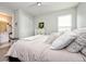 Bright bedroom with a large window, closet, and doorway to the bathroom at 4906 Los Robles Ct, Palmetto, FL 34221