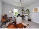 Comfortable home office with a desk setup, statement rug, and an abundance of natural light at 4906 Los Robles Ct, Palmetto, FL 34221