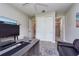 Home office featuring a work desk, chair, and a closet for extra storage at 4906 Los Robles Ct, Palmetto, FL 34221