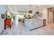 Open-concept kitchen with a large island, modern appliances, and stylish pendant lighting at 4906 Los Robles Ct, Palmetto, FL 34221