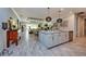 Modern open-concept kitchen with granite countertops, stainless steel appliances, and pendant lighting at 4906 Los Robles Ct, Palmetto, FL 34221