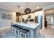Spacious kitchen features an island with granite countertops and modern stainless steel appliances at 4906 Los Robles Ct, Palmetto, FL 34221