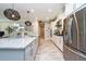 Contemporary kitchen featuring a large island, stainless steel appliances, and stylish pendant lights at 4906 Los Robles Ct, Palmetto, FL 34221