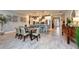 Well-appointed kitchen featuring a central island, tile flooring, adjacent dining area, and modern finishes at 4906 Los Robles Ct, Palmetto, FL 34221