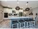 Beautiful kitchen features stainless appliances, a large island with bar seating and pendant lighting at 4906 Los Robles Ct, Palmetto, FL 34221