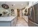 Bright kitchen showcasing a large island with counter seating and stainless steel appliances at 4906 Los Robles Ct, Palmetto, FL 34221