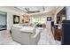 Inviting living room with comfortable seating, a decorative ceiling, and a view of the backyard at 4906 Los Robles Ct, Palmetto, FL 34221