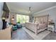 Comfortable main bedroom features neutral colors, large windows, and a ceiling fan at 4906 Los Robles Ct, Palmetto, FL 34221