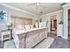 Spacious main bedroom featuring a large bed, stylish furniture, and a calming ambiance at 4906 Los Robles Ct, Palmetto, FL 34221
