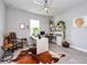 Bright home office with modern desk, custom cabinets, and stylish decor at 4906 Los Robles Ct, Palmetto, FL 34221