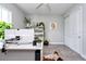 Bright home office with modern desk, custom cabinets, and stylish decor at 4906 Los Robles Ct, Palmetto, FL 34221