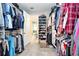 Spacious walk-in closet with custom shelving, multiple hanging rods, and ample storage space at 4906 Los Robles Ct, Palmetto, FL 34221