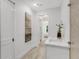 Bright bathroom with double sinks, modern art, and a large glass shower with patterned tile at 50 64Th S St, St Petersburg, FL 33707