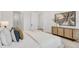Bedroom with a king-size bed, neutral decor, modern furniture, and view into the hall at 50 64Th S St, St Petersburg, FL 33707
