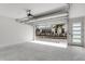 This spacious garage features a modern door opener and sleek, polished concrete floors and a pedestrian door at 50 64Th S St, St Petersburg, FL 33707