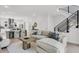Bright, open living space with modern staircase, dining area, and comfortable seating for relaxation at 50 64Th S St, St Petersburg, FL 33707