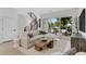 Bright living room with modern sofa, wood accents, and large windows, creating a cozy and inviting space at 50 64Th S St, St Petersburg, FL 33707