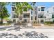 Contemporary townhomes with stone accents, black metal fences, and landscaped front yards add curb appeal at 50 64Th S St, St Petersburg, FL 33707