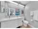 Modern bathroom with double sinks, a large mirror, and sleek fixtures for a spa-like experience at 511 Foxglove Cir # B, Sun City Center, FL 33573