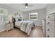 Serene bedroom with a ceiling fan, natural light, and light-colored furniture for a relaxing ambiance at 511 Foxglove Cir # B, Sun City Center, FL 33573
