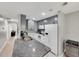 Modern kitchen featuring granite countertops, stainless steel appliances, and stylish gray cabinets at 511 Foxglove Cir # B, Sun City Center, FL 33573