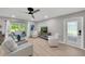 Bright living room featuring comfortable seating, modern decor, and sliding glass doors to an outdoor space at 511 Foxglove Cir # B, Sun City Center, FL 33573