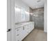 Beautiful bathroom featuring double sinks, marble countertops, and large glass shower at 5124 3Rd N Ave, St Petersburg, FL 33710