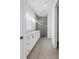 Hallway view of bathroom with dual sinks, marble countertops and large glass shower at 5124 3Rd N Ave, St Petersburg, FL 33710