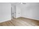 Bright bedroom features wood-look floors and a modern ceiling fan at 5124 3Rd N Ave, St Petersburg, FL 33710