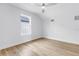 Cozy bedroom features wood-look floors, window and sloped ceilings at 5124 3Rd N Ave, St Petersburg, FL 33710