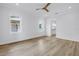 Bright bedroom features light wood floors, white walls, base molding, and natural light at 5124 3Rd N Ave, St Petersburg, FL 33710