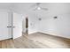 Light and airy bedroom features wood-look floors, modern ceiling fan and closet at 5124 3Rd N Ave, St Petersburg, FL 33710