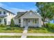 Charming craftsman-style home with gray exterior, manicured lawn, and inviting front porch at 5124 3Rd N Ave, St Petersburg, FL 33710