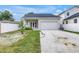 Traditional one-story home with large driveway and manicured lawn at 5124 3Rd N Ave, St Petersburg, FL 33710