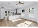 Bright kitchen boasts an eat-in island, stainless appliances, stone countertops, and access to the backyard at 5124 3Rd N Ave, St Petersburg, FL 33710