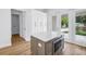Kitchen island features stone countertops, built-in microwave, and access to the backyard at 5124 3Rd N Ave, St Petersburg, FL 33710