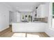 Kitchen features stainless appliances, backyard access, an eat-in island, and ample cabinet space at 5124 3Rd N Ave, St Petersburg, FL 33710