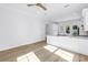 Modern kitchen features light wood floors, white cabinets, stone countertops, and backyard access at 5124 3Rd N Ave, St Petersburg, FL 33710