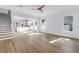Bright living room with hardwood floors, ample natural light, and staircase to the second floor at 5124 3Rd N Ave, St Petersburg, FL 33710