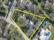 Aerial view showcasing the property layout, including the home, landscaping, and lot size at 6207 Ridge Top Dr, New Port Richey, FL 34655