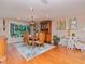 Formal dining room with hardwood floors, elegant furnishings, and abundant natural light at 6207 Ridge Top Dr, New Port Richey, FL 34655