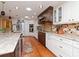 Traditional kitchen with granite countertops, stainless steel appliances and hardwood floors at 6207 Ridge Top Dr, New Port Richey, FL 34655
