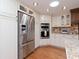 Bright eat-in kitchen with stainless steel appliances, granite countertops, and abundant cabinet space at 6207 Ridge Top Dr, New Port Richey, FL 34655